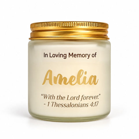 Personalized memorial candle in a frosted glass jar with a gold lid, In Loving Memory label with the name Amelia