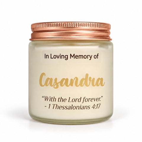 Personalized memorial candle in a frosted jar with a rose-gold lid, label with the name Casandra