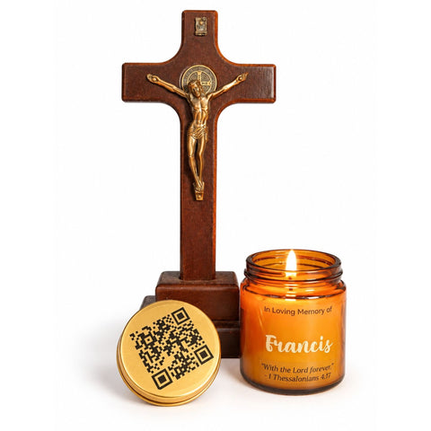 Amber Francis memorial candle with a gold QR code lid beside a wooden crucifix