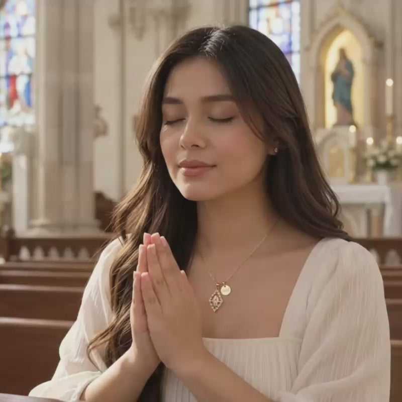 Video of gold diamond-shaped Virgin Mary necklace with crystal frame and personalized name charm